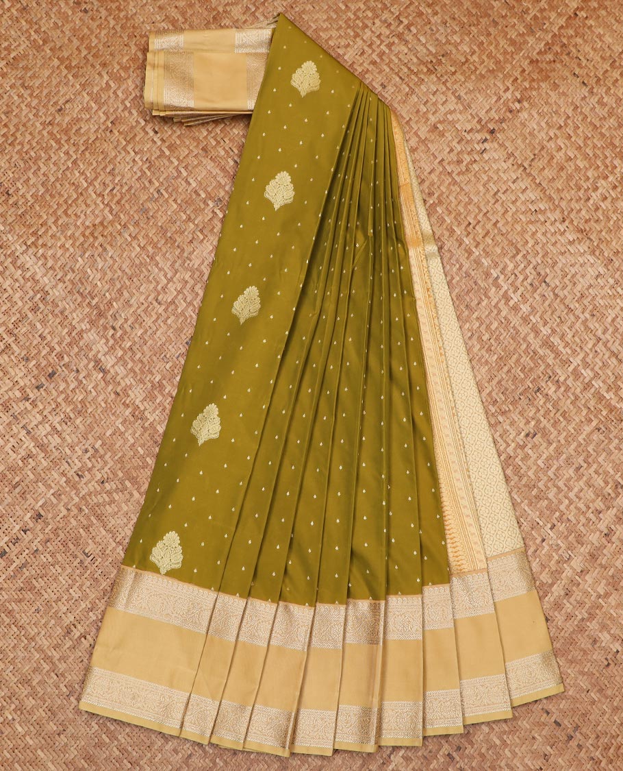 Green zari buttas gift saree, contrast traditional zari rettai pettu border, and pallu of jaal design