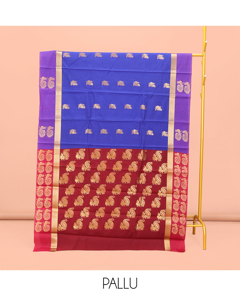 Royal Blue Semi-Silk Cotton Saree, Majestically Detailed with Peacock Buttas All Over Its Body, Complemented by a Contrast Peacock Buttas Border, Pallu Steeped with Peacock Design, and Paired with a Matching Blouse