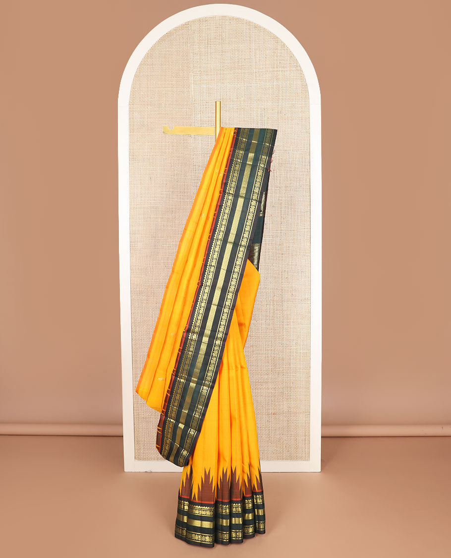 Orange zari buttas kanchipuram silksaree, contrast one-sided thazampoo rekku border of salngai,banaras,mayil & vanki & zari design pallu