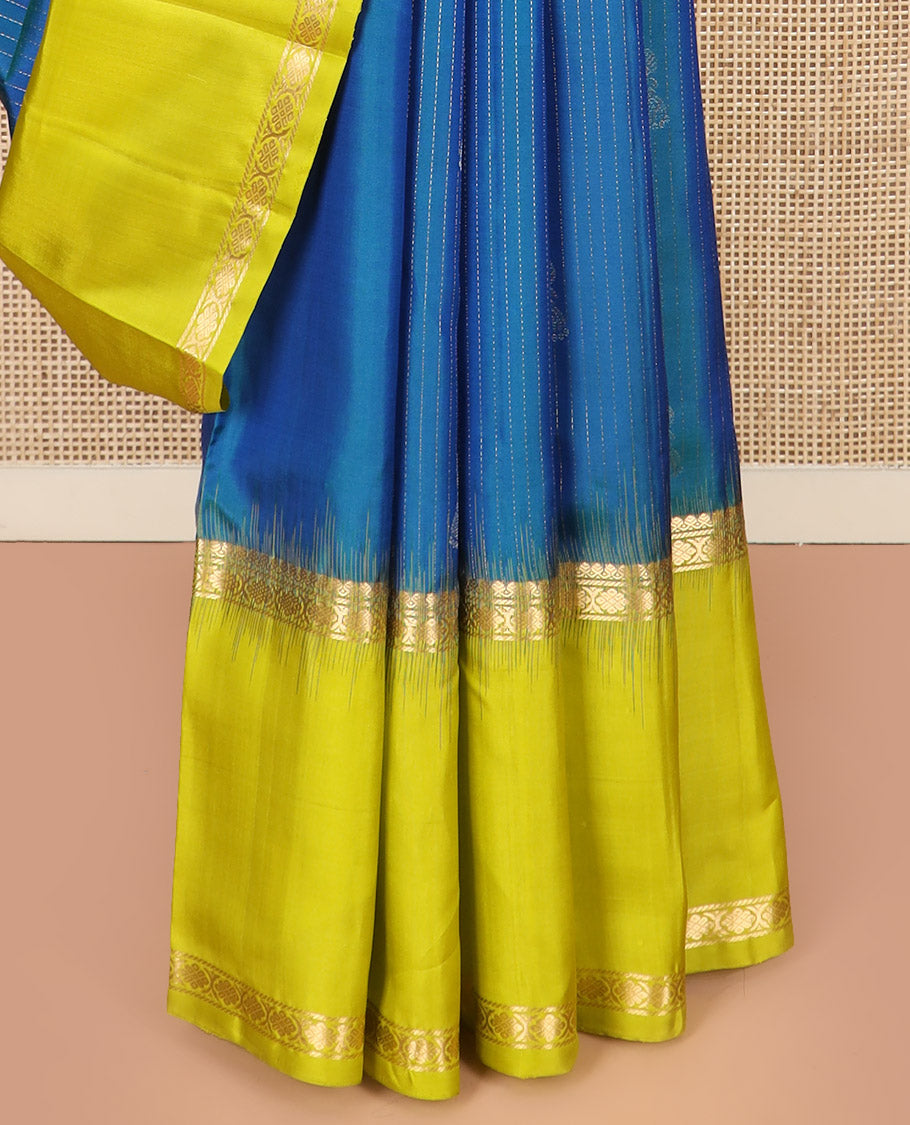Blue Kanchipuram Silk Saree, Sparsely Sparkled with Muthu Stripes and Jhumka Buttas All Over Its Body, Complemented by a Contrast Rettai Pettu Border of Thilakam Mokku, and Laddu Kamalam Designs, Subtly Sparkled Pallu, and Paired with a Contrast Blouse