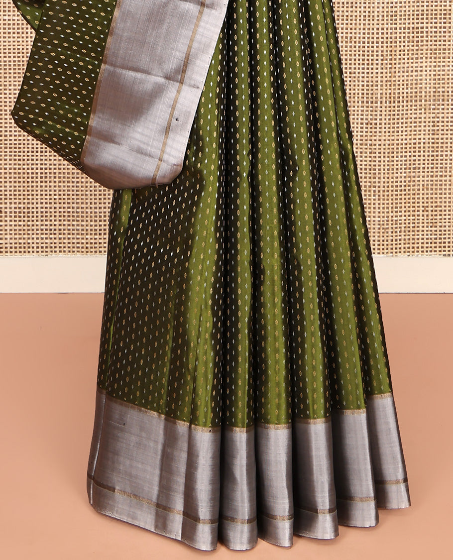 Green Mayuri Soft Silk Saree, Steeped with Buttas All Over Its Body, Complemented by Contrast Border, Pallu of Chevron Stripes, and Paired with a Contrast Blouse