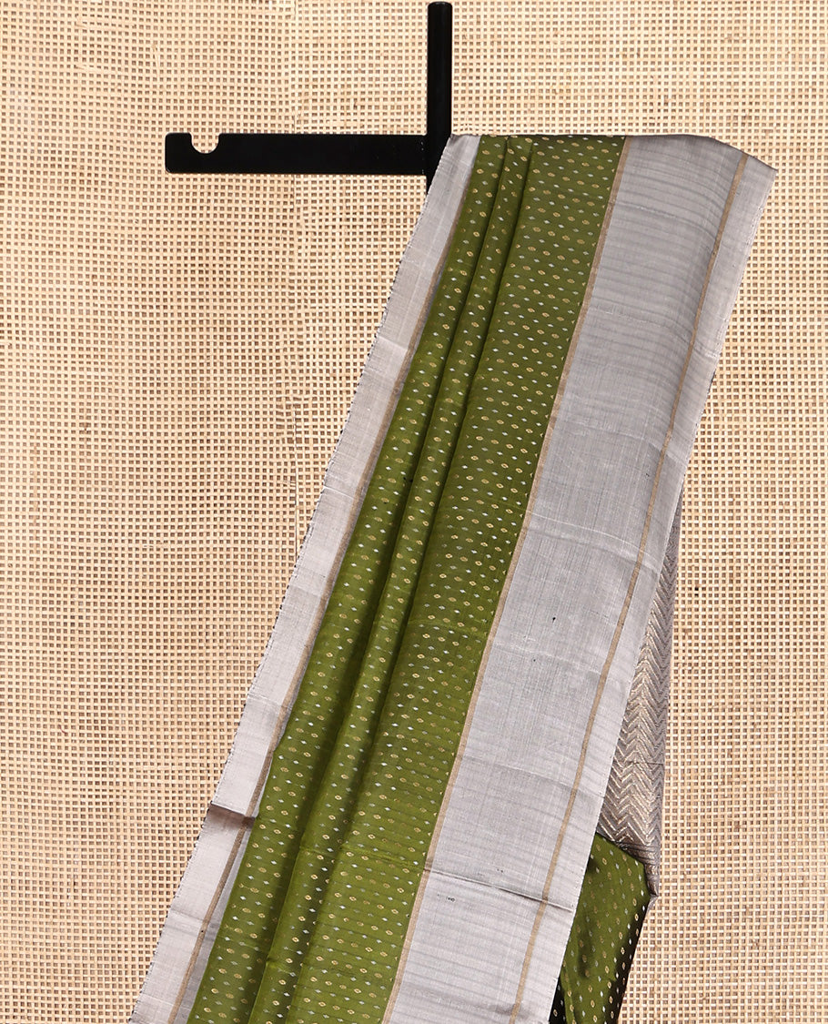Green Mayuri Soft Silk Saree, Steeped with Buttas All Over Its Body, Complemented by Contrast Border, Pallu of Chevron Stripes, and Paired with a Contrast Blouse