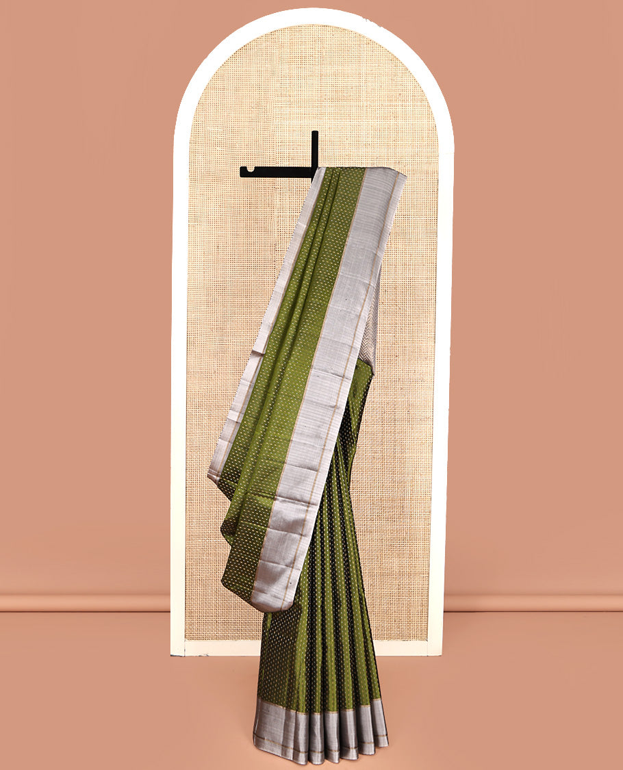 Green Mayuri Soft Silk Saree, Steeped with Buttas All Over Its Body, Complemented by Contrast Border, Pallu of Chevron Stripes, and Paired with a Contrast Blouse