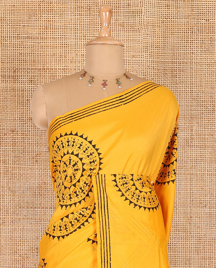 Yellow warli village theme printed South cotton saree, block printed border, warli printed pallu, a matching blouse, and a contrast floral vine printed blouse