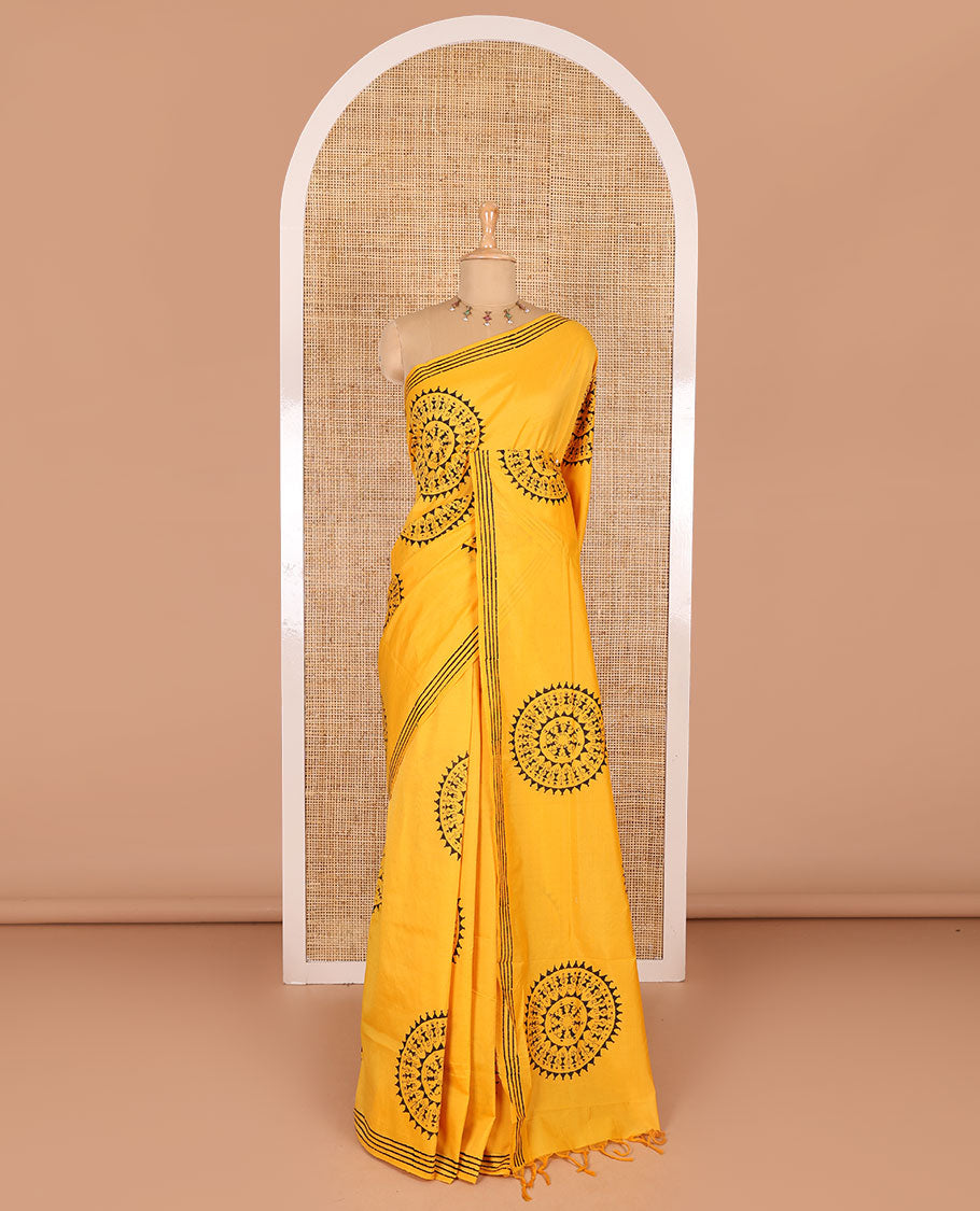 Yellow warli village theme printed South cotton saree, block printed border, warli printed pallu, a matching blouse, and a contrast floral vine printed blouse
