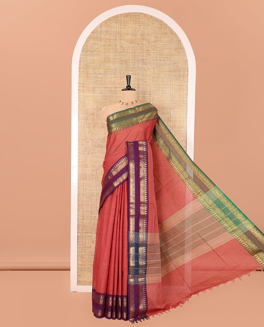 Dusky Pink Plain Chettinad Cotton Saree, Complemented by a Contrast Ganga-Jamuna Rettai Pettu Border of Temple and Rudraksham Designs, Subtly Striped Pallu, and Paired with a Matching Blouse