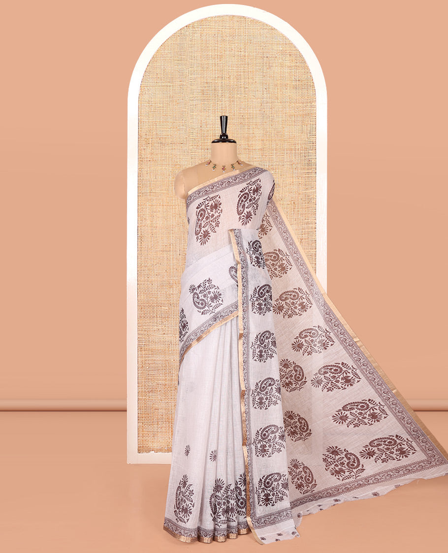 Cream Linen Cotton Saree, Decked Up with Floral-Paisley Motifs Print All Over Its Body, Highlighted by Gold Zari Printed Border, Floral-Paisley Printed Pallu and Paired with a Matching Blouse