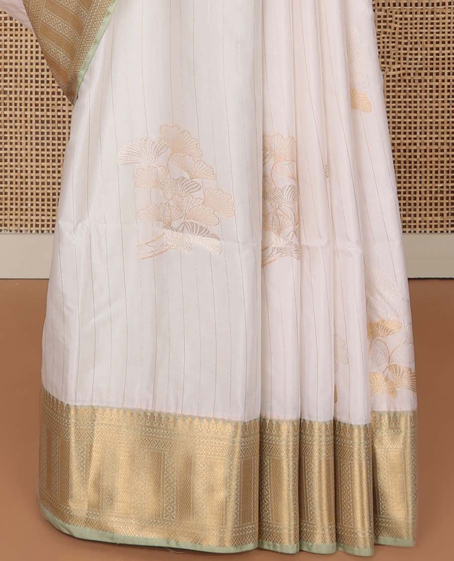 White striped, motifs soft silk saree with contrast striped border & floral design pallu