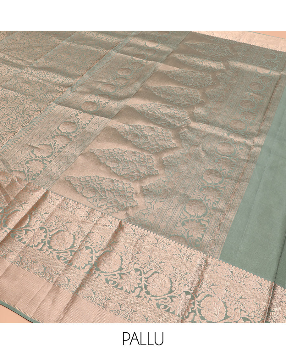 Green Kanchipuram Silk Saree Highlighted by Jacquard Design, Complemented by Zari Border of Thilakam Mokku, Manga, Jaal, and Kodi Visiry Designs, Pallu Elevated with Intricate Zari Designs, and Paired with a Matching Blouse