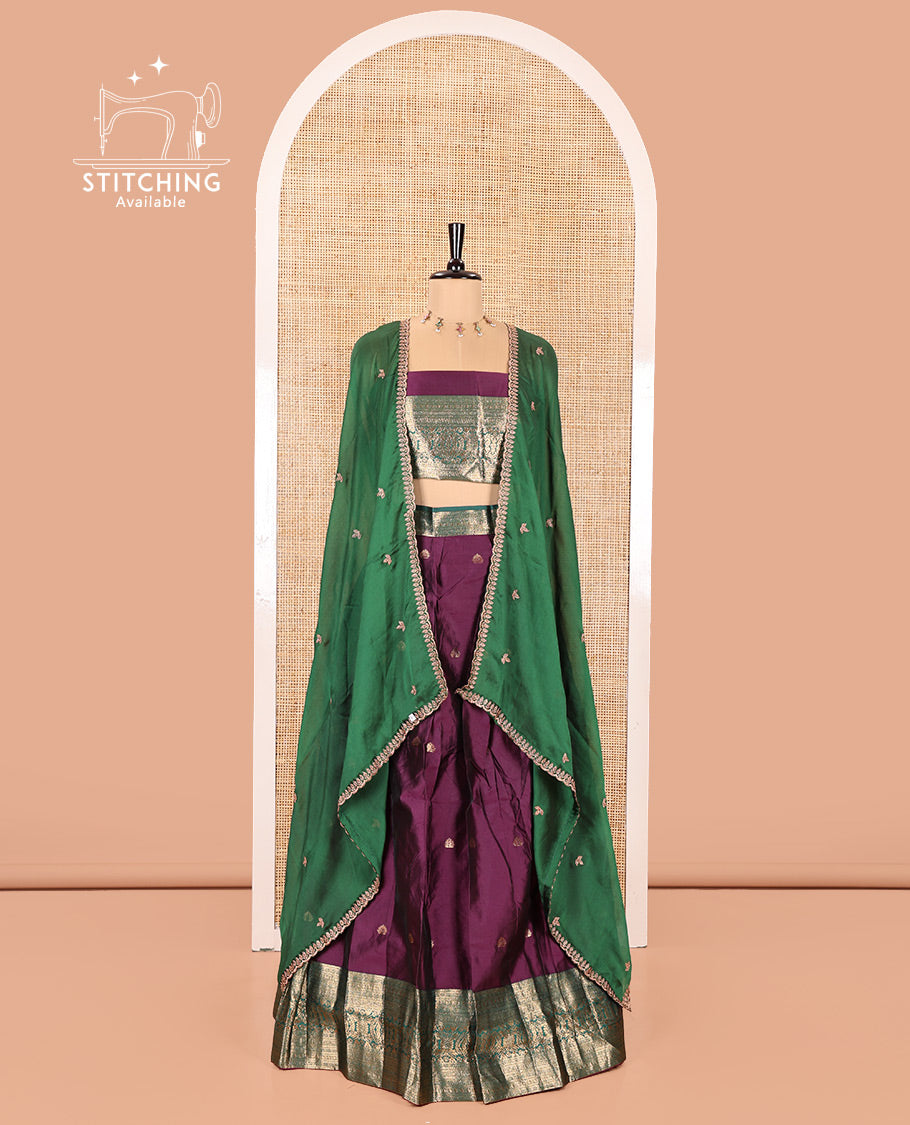 Purple and Green Semi-Banarasi Half-Saree, Beautified with Zari Buttas on Its Skirt, Complemented by a Contrast Traditional Zari Design Woven Border, Paired with a Matching Blouse, and a Contrast Satin Georgette Embroidered Scallop Dhavani