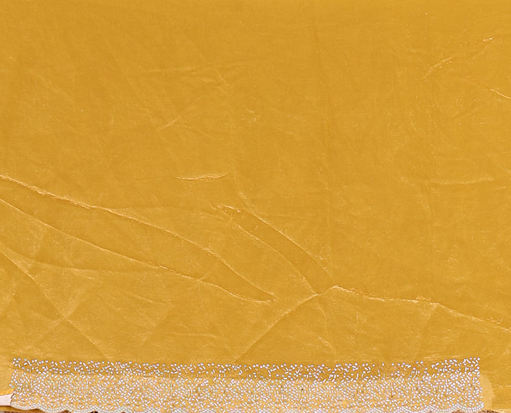 Mustard Swarovski crystal stone embedded fendy chiffon saree, scallop Swarovski stone embroidered border, and contrast plain blouse