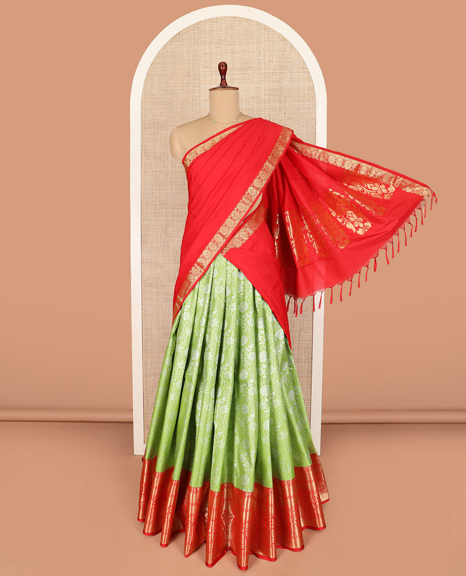 Light Green Art Silk Material Half Saree Set Featuring Floral Jacquard Skirt, a Contrast Traditional Zari-Design Border, a Zari-Bordered Blouse, and a Dhavani Elevated with Floral Zari Designs
