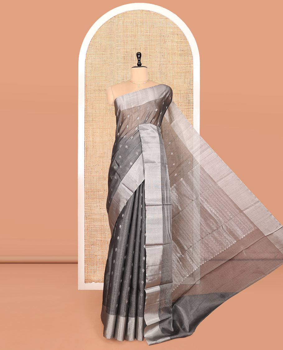 Grey Silk Cotton Saree, Gleamed up with Buttas, a Subtle Bavanji Border, Grand Geometric Patterned Pallu, and a Matching Blouse