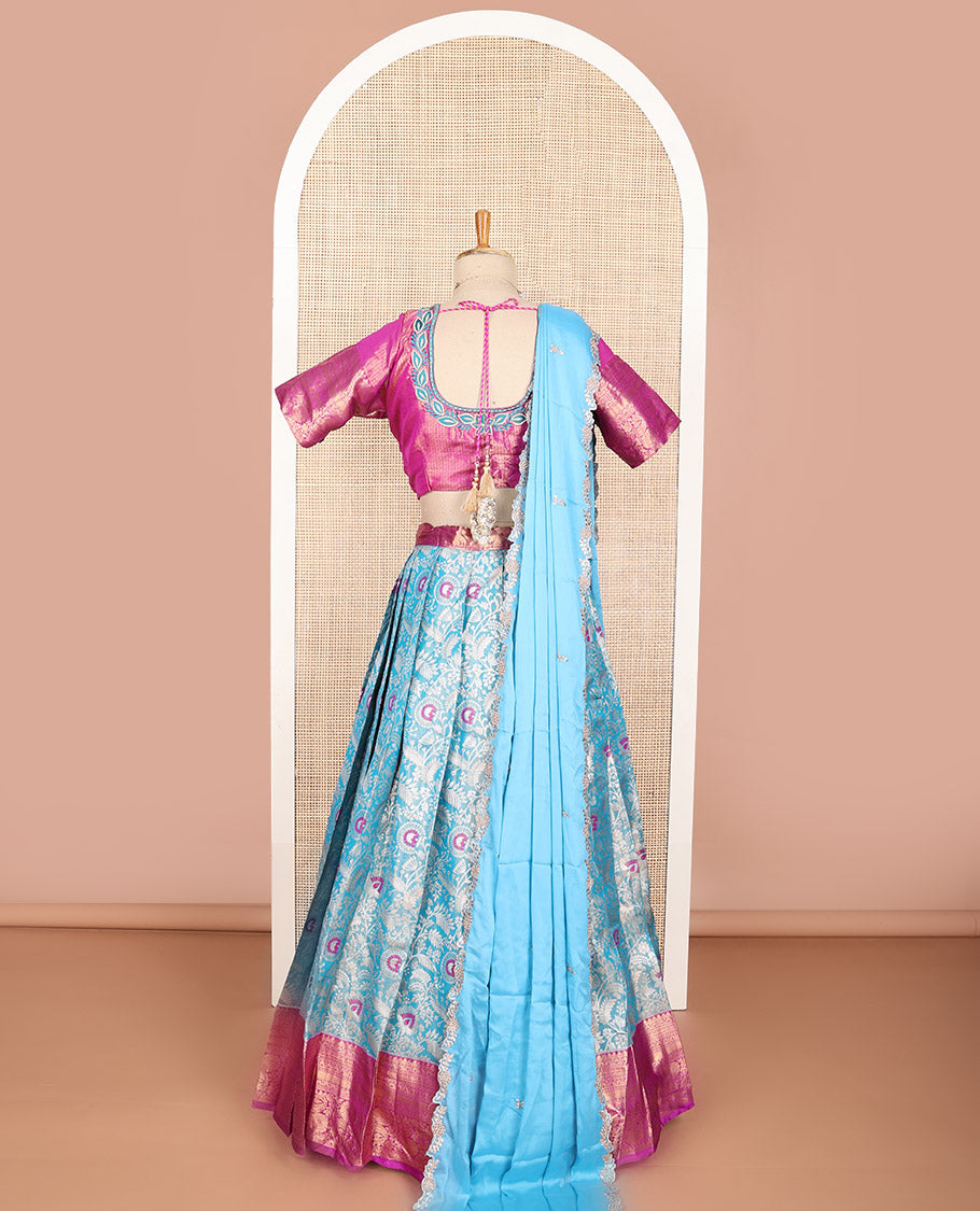 Light blue floral art silk half saree with contrast zari design border, embroidered blouse & floral embroidery dhavani