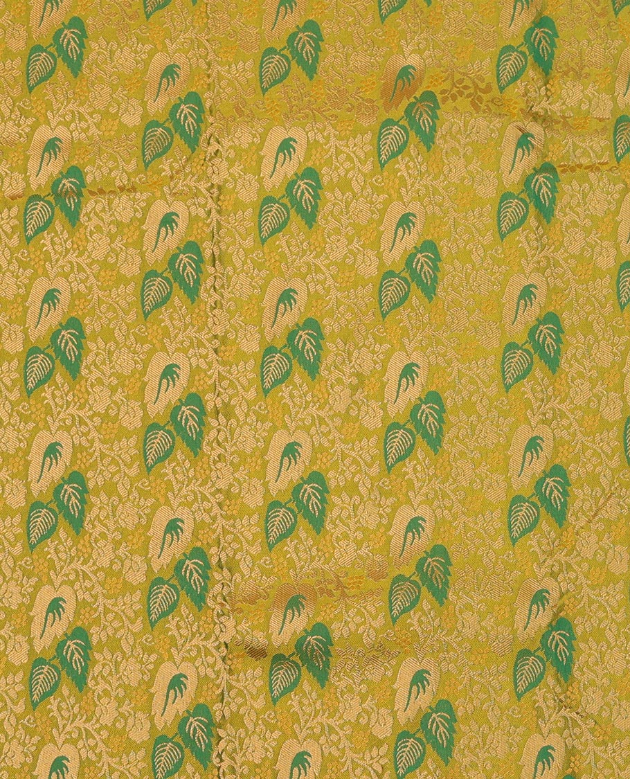 Green Art Silk Pavadai Material Set Mesmerized with Leaf Jacquard Design on Its Skirt, Complemented by a Contrast Floral Zari Design Border, and Paired with a Contrast Blouse