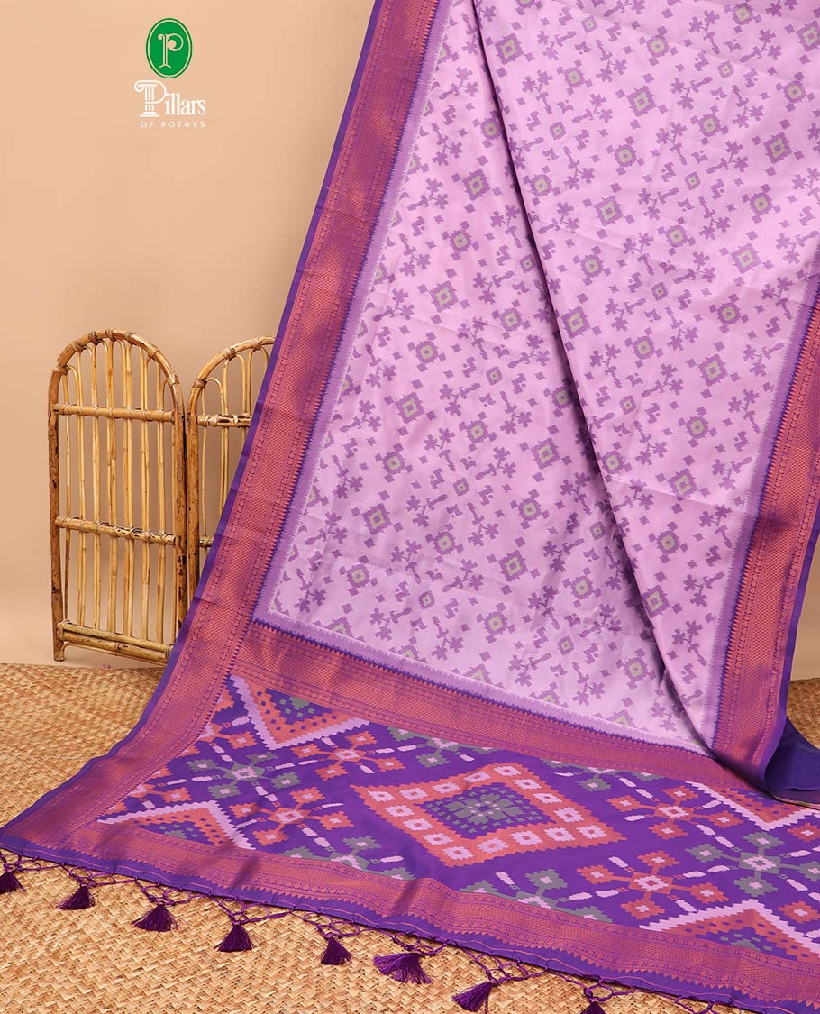 Lavender ikkat design mulberry silk saree with contrast border & ikkat pallu along with self embosed butta blouse
