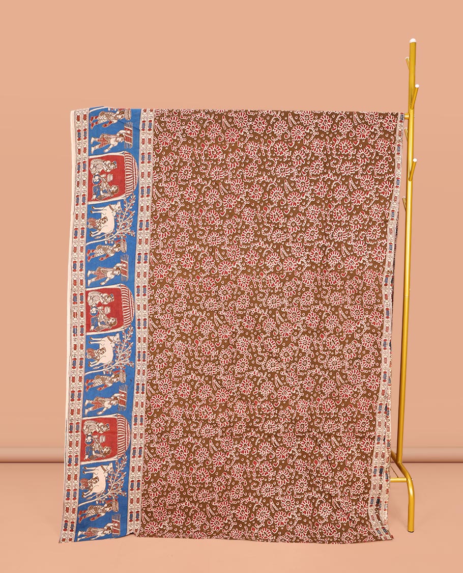 Brown Machine-Printed Kalamkari Cotton Saree, Decked Up with Floral Motifs on Its Body, Complemented by a Contrast Village-Theme Printed Border, Pallu of Peacock Motifs Print, and Paired with a Printed Blouse