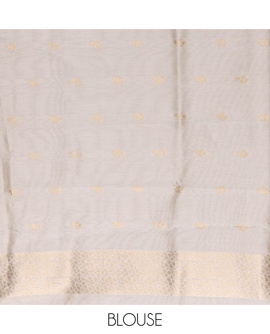 Cream Semi Tussar Saree Enriched with Zari Floral Buttas, Gleaming Zari Design Border, Majestically Detailed Pallu in Zari, and Paired with a Matching Blouse