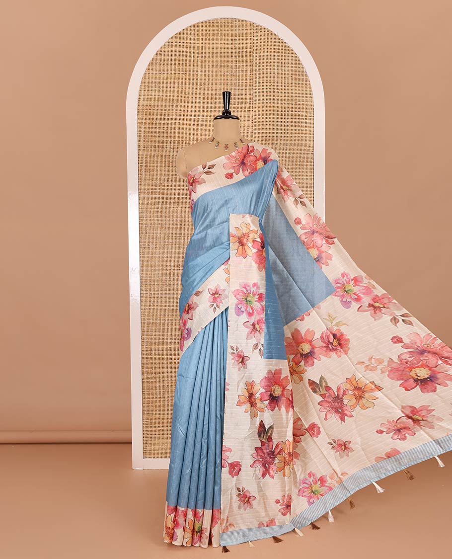 Blue plain fancy tussar digital printed saree, contrast floral digital printed border, floral printed pallu, and a floral printed blouse