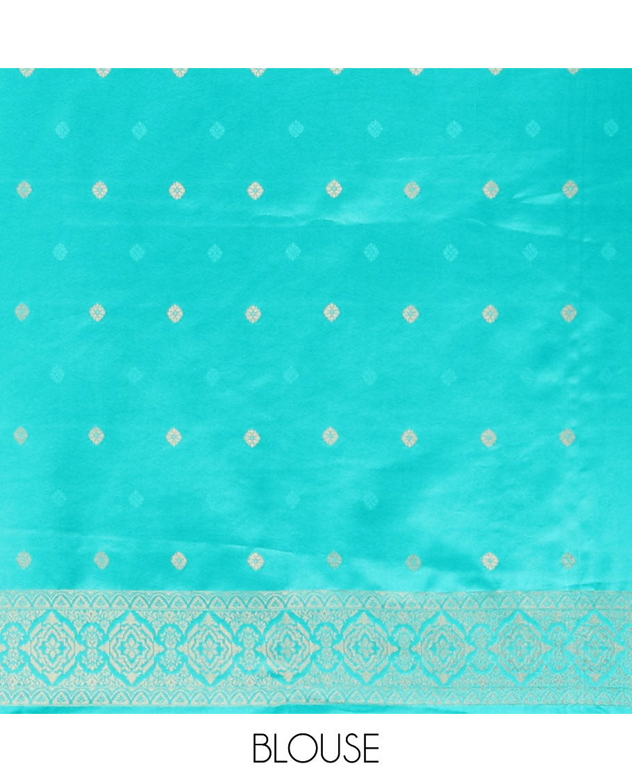 Emerald blue allover embosed with gold zari figure design , zari weaving rich pallu with tussels & self small butta blouse