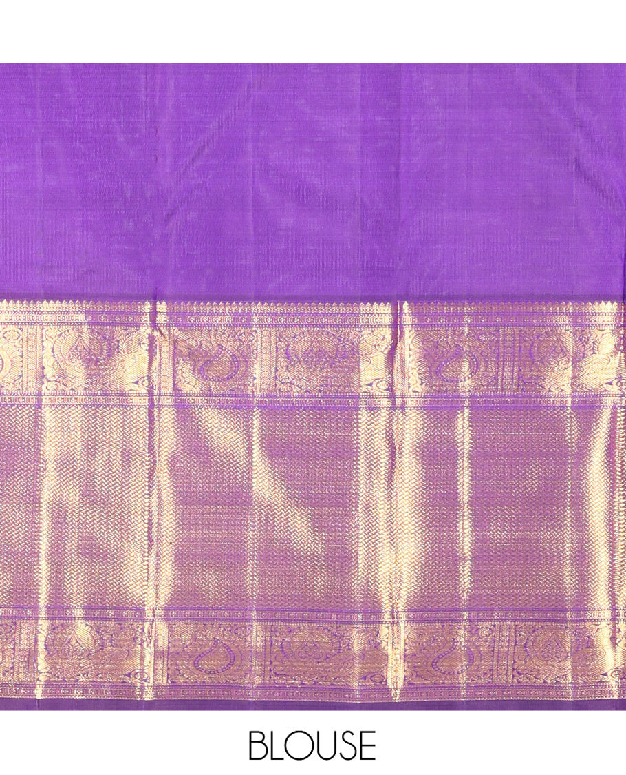 Violet Kanchipuram Silk Saree, Opulently Embellished with Jhumka Zari Buttas, Highlighted by a Zari Border of Arumbu Manga, Mayil, and Paiyadi Kann, Grand Pallu, and Matching Blouse