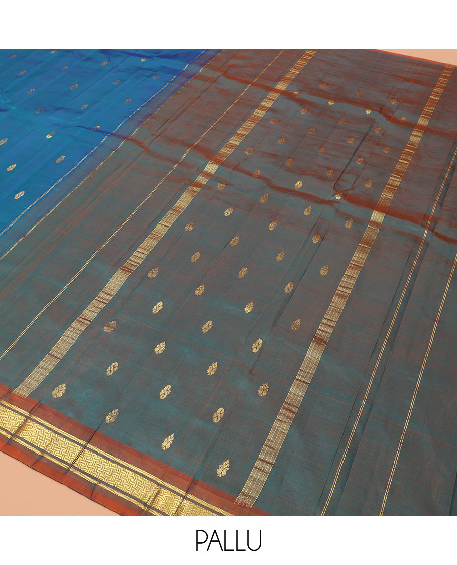 Blue Kanchipuram Silk Saree, Elevated with Zari Buttas, Complemented by a Contrast One-Sided Border of Banaras, and Mayil Kann Designs, Zari Woven Pallu, and a No Blouse