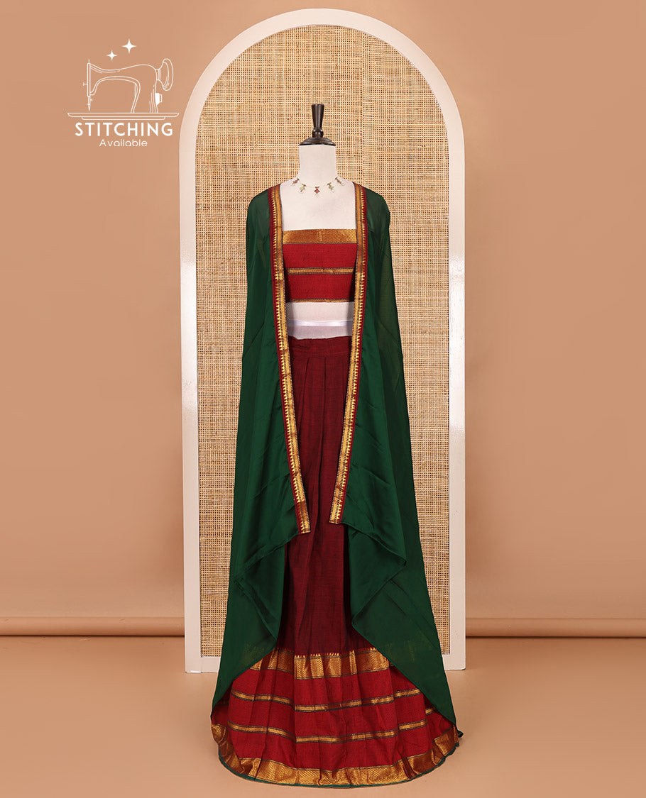 Maroon-green mercerised cotton half-saree, plain & contrast traditional zari big border skirt, traditional motifs matching blouse & contrast Syska georgette dhavani