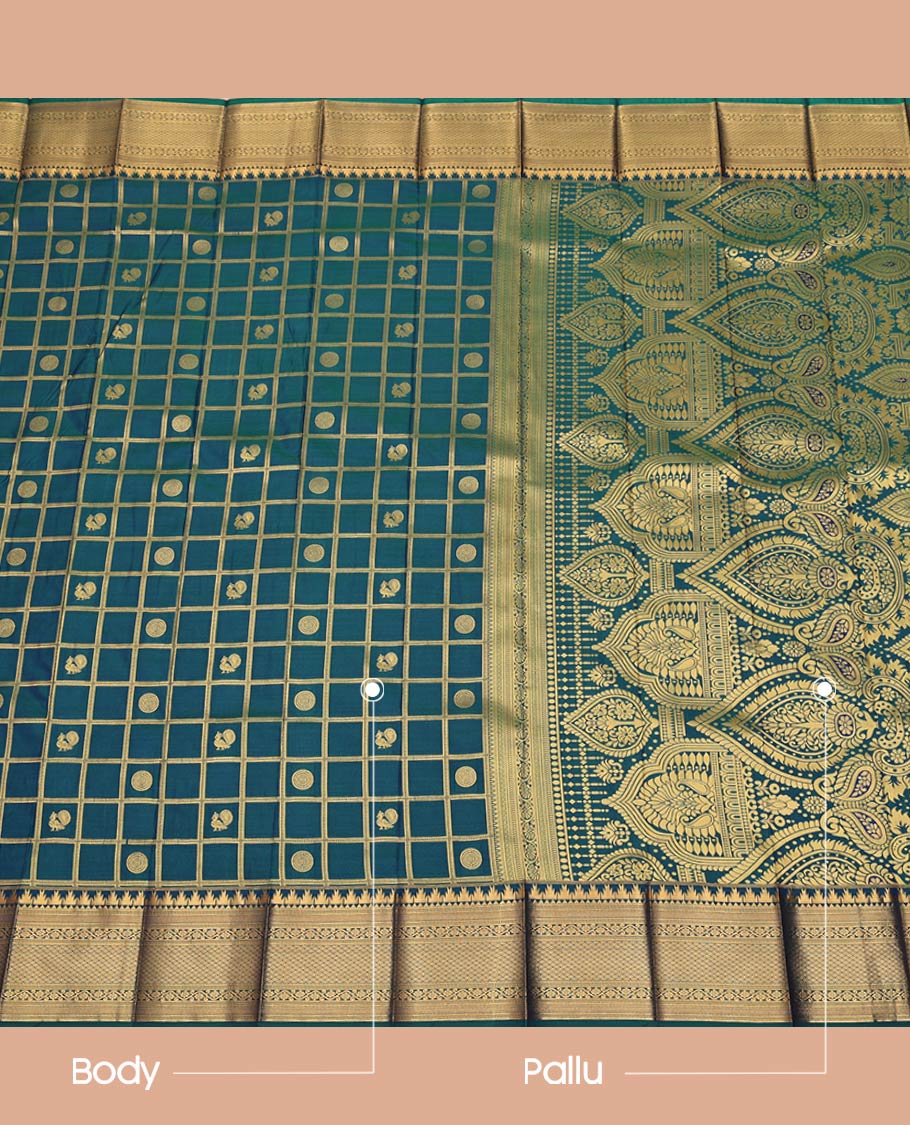 Blue Budget Silk Saree, Elegantly Detailed with Peacock-Chakram Butta Enclosed Checks All Over Its Body, Highlighted by a Temple Zari Border of Traditional Designs, Pallu Depicts Mughal-Style Designs, and Paired with a Matching Blouse