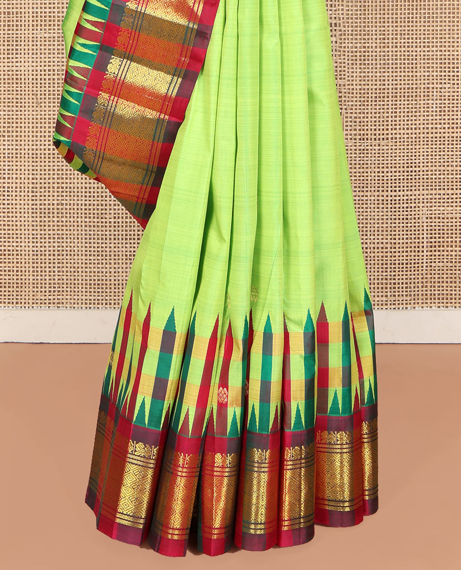 Green Kanchipuram Silk Saree, Delicately Woven with Zari Buttas on Its Body, Complemented by a Contrast One-Sided Thazampoo Rekku Border of Mayil and Jaal Designs, Pallu Depicts Zari Designs, and Comes Without a Blouse