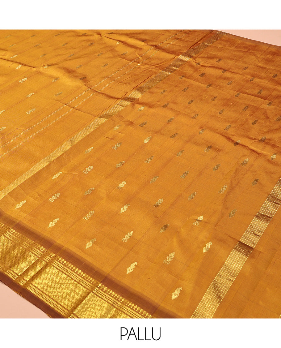 Mustard Kanchipuram Silk Saree, Adorned with Zari Buttas, a Contrast One-Sided Border of Panner Sombu, Banaras, Muthu, and Mayil Kann Designs, Zari Design Pallu, and No Blouse