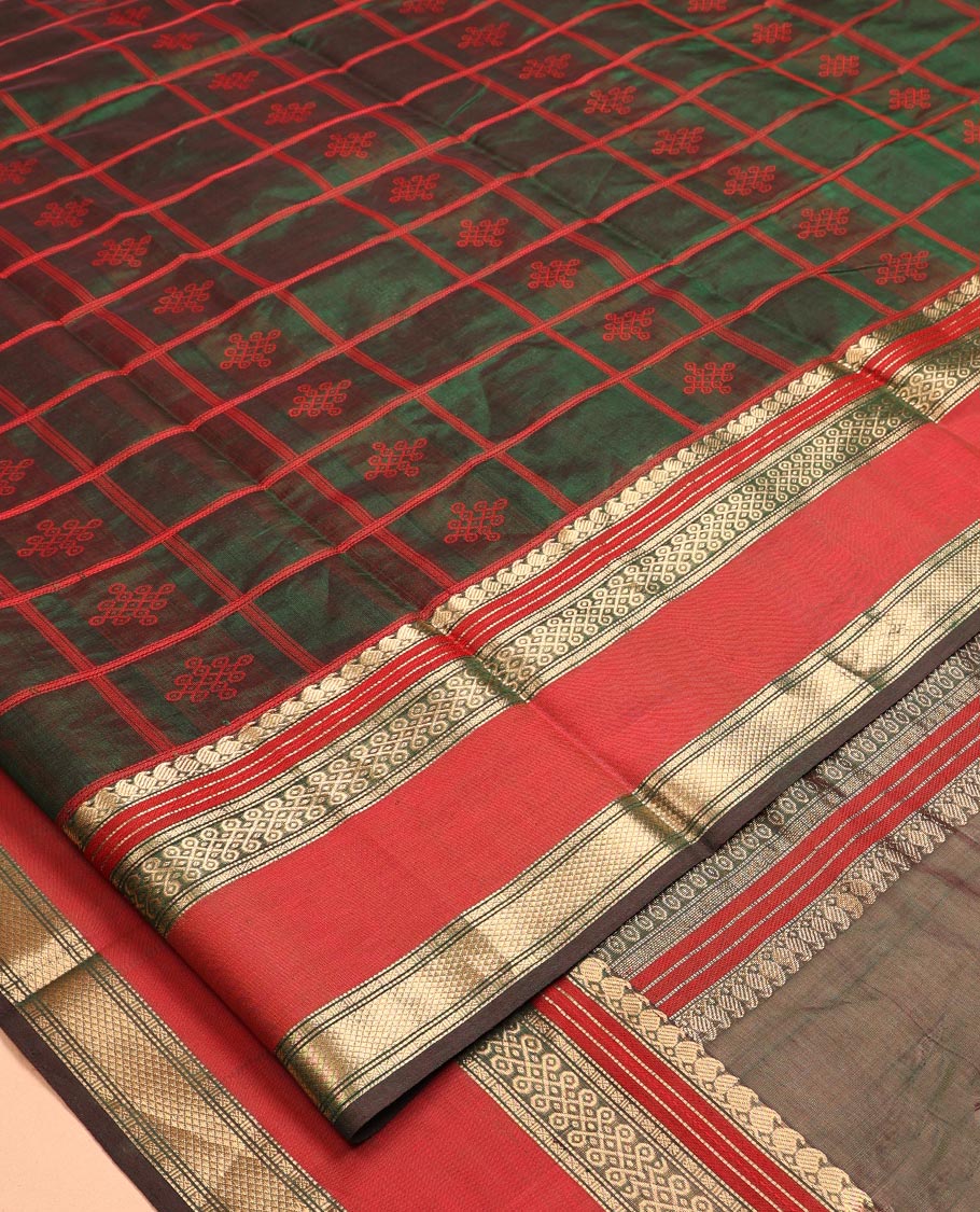 Green Kuppadam Silk Saree, Mesmerised with Kolam Butta Enclosed Checks, a Contrast Traditional Kolam Border, Pallu of Kolam Designs, and a Matching Blouse
