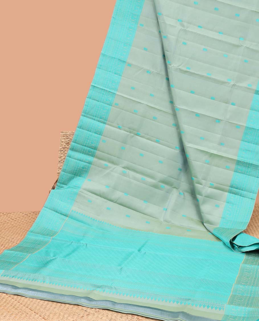 Green buttas kancheepuram silk saree with contrast border of intricate zari design & striped floral design pallu