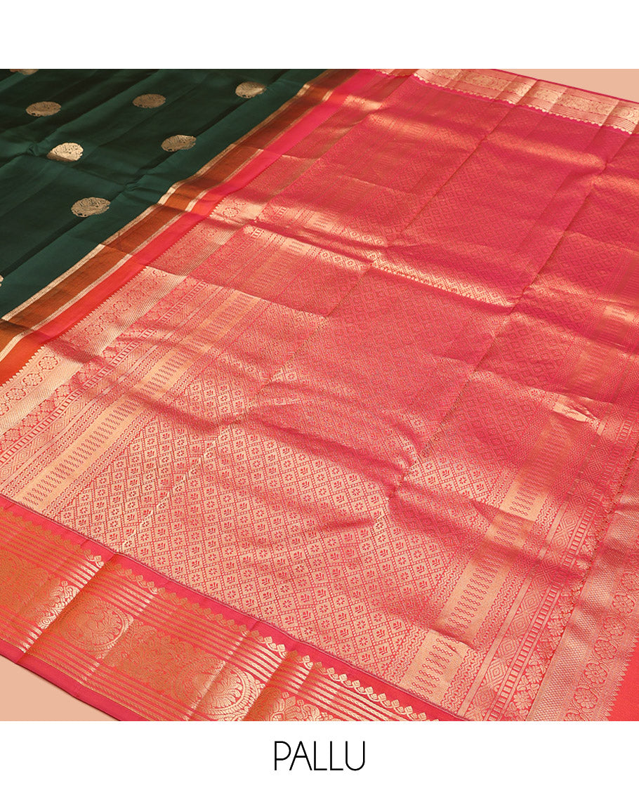 Green Vasundhara Silk Saree, Elevated with Mayil Zari Buttas All Over Its Body, Complemented by a Contrast Border of Thilakam Mokku, Kathir, and Round Mayil Designs, Grand Jaal Pallu, and Paired with a Contrast Blouse