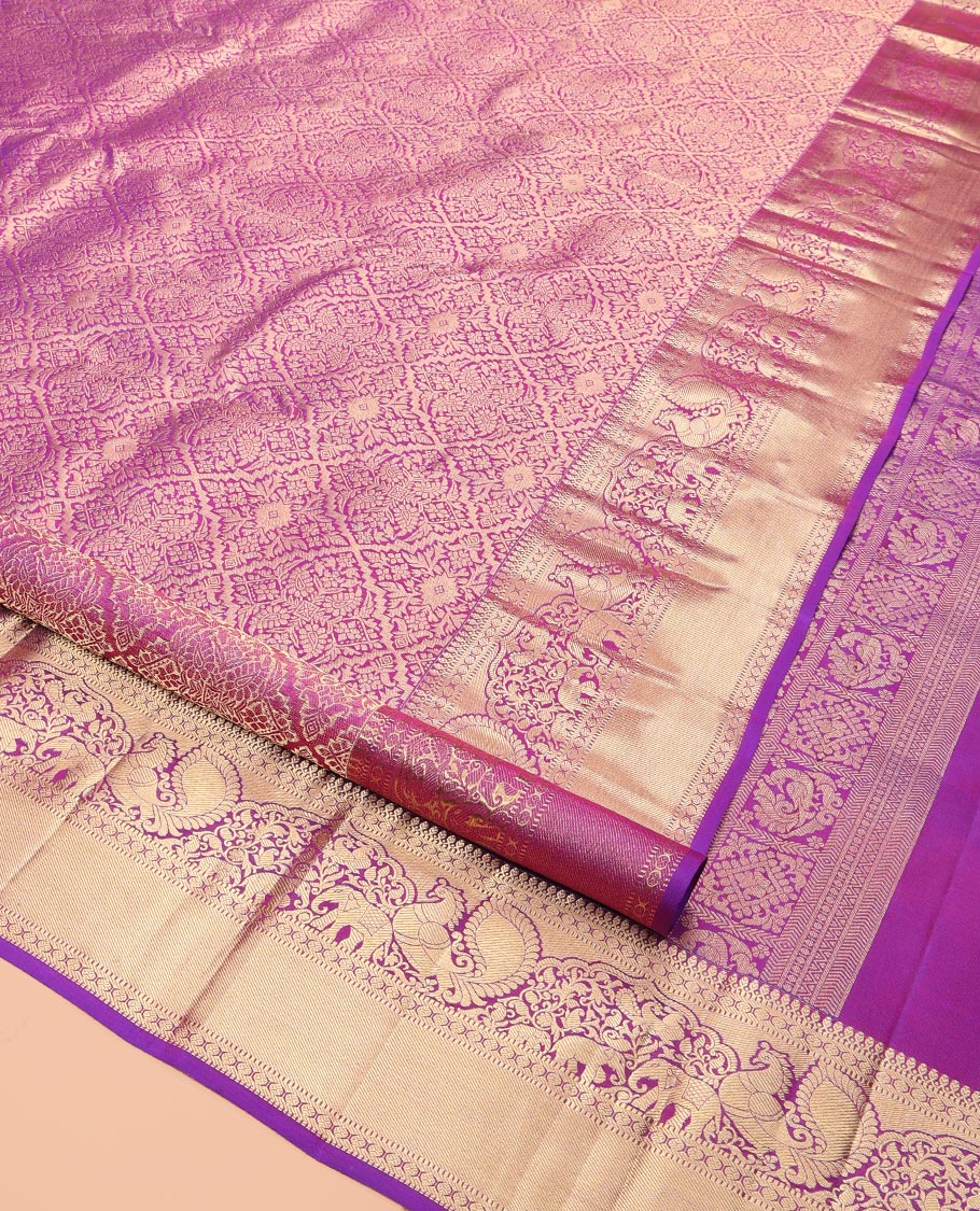Pink Kanchipuram Wedding Silk Saree, Graced with Jacquard Design, a Zari Border of Thilakam Mokku, Muthu, Rudraksham, Yaanai and Mayil, Grand Pallu, and a Matching Blouse