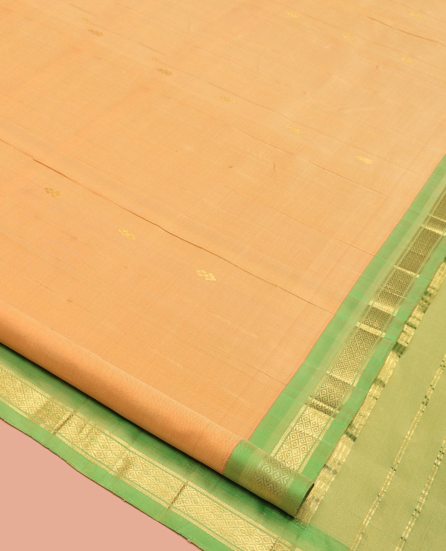 Orange Kanchipuram Silk Saree, Sparsely Woven with Zari Buttas, a Contrast One-Sided Border of Mayil Kann Designs, a Zari-Design Pallu, and No Blouse