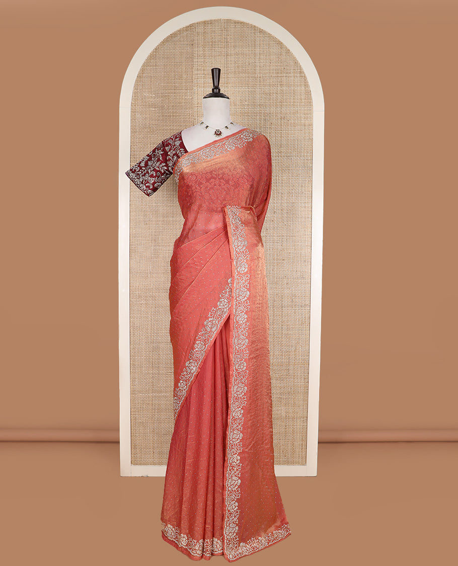 Peach stone work designer saree, micro-stone work border, and a contrast half-sleeve blouse of floral vine design in micro stones