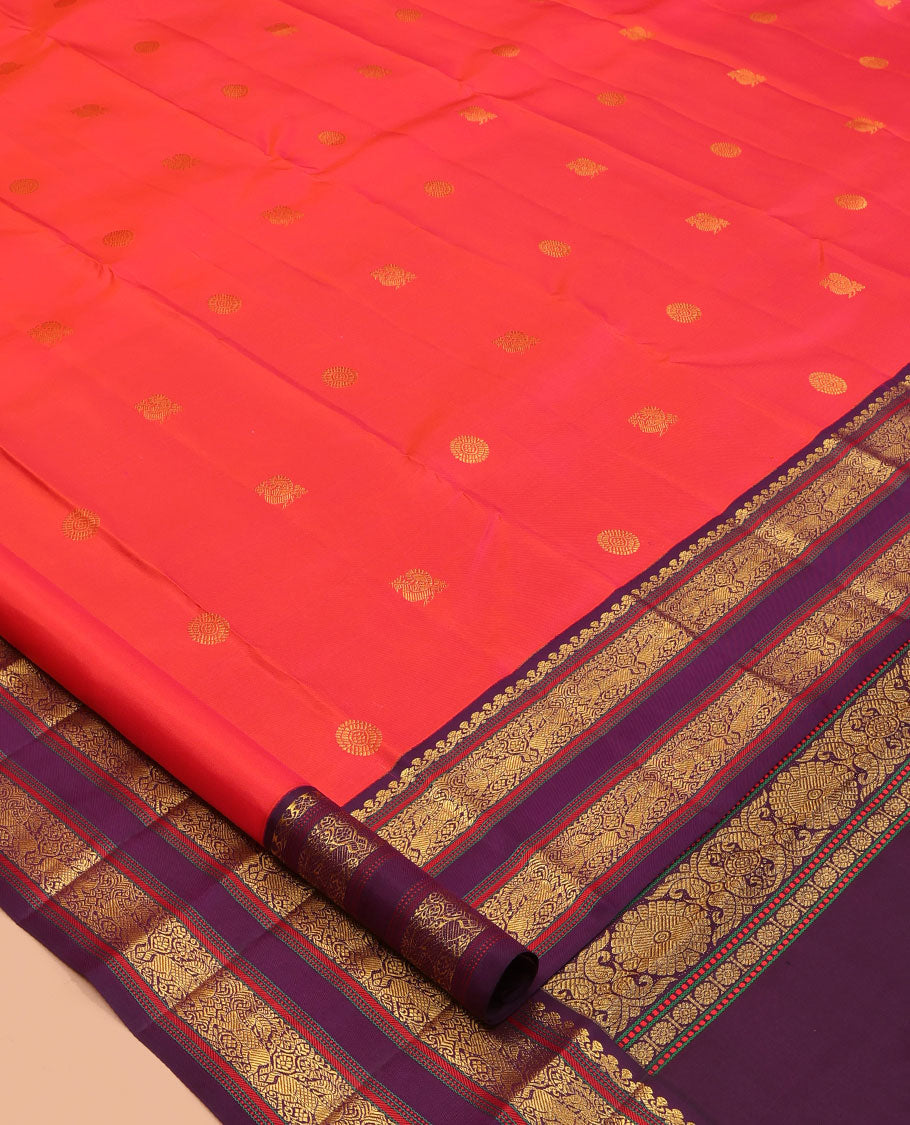 Orange Kanchipuram Silk Saree, Graced with Mayil-Chakram Buttas, a Contrast Korvai Rettai Pettu Border of Muthu, Muthu, and Kuthirai Designs, Traditional Pallu, and a Contrast Blouse