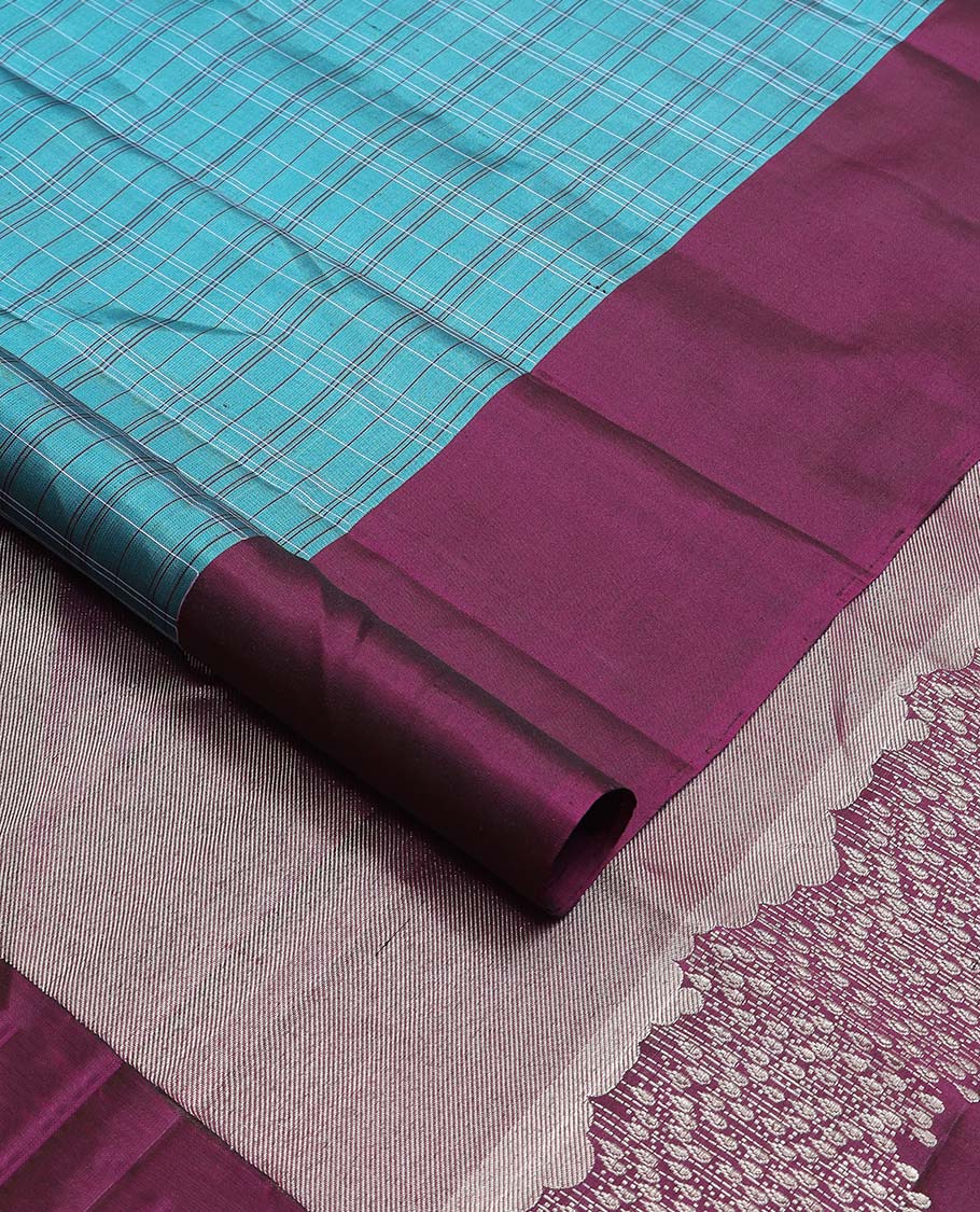 Blue checked, motifs mayuri soft silk saree with contrast border & zari design pallu