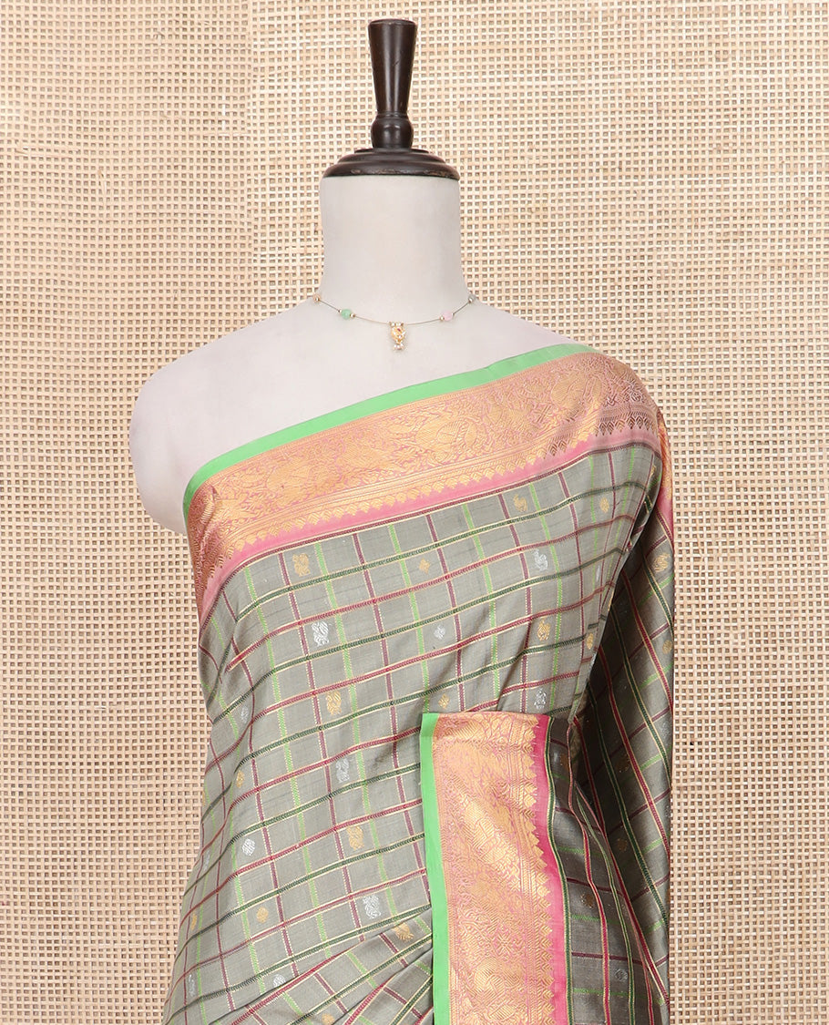 Grey Gadwal Saree Decorated with Buttas and Checks, a Contrasting Border Woven with Traditional Zari Designs, the Pallu Is Complemented by Jaal Design, and a Contrast Blouse