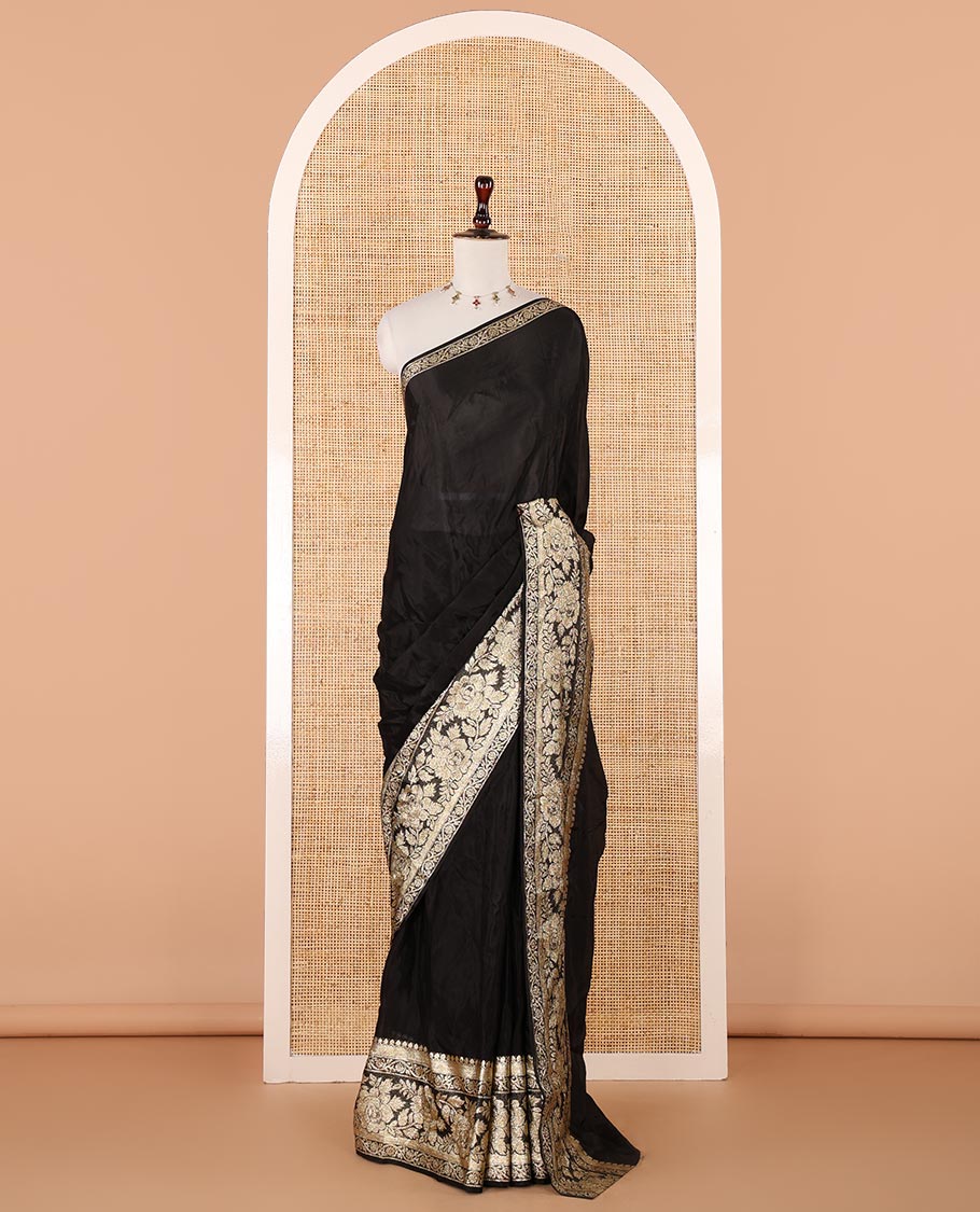 Black plain crepe saree, zari border steeped with rose floral designs, plain pallu & blouse of zari polka dots