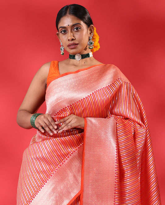 Orange geometric patterns striped organza saree, contrast traditional zari design border & zari-rich intricate pallu