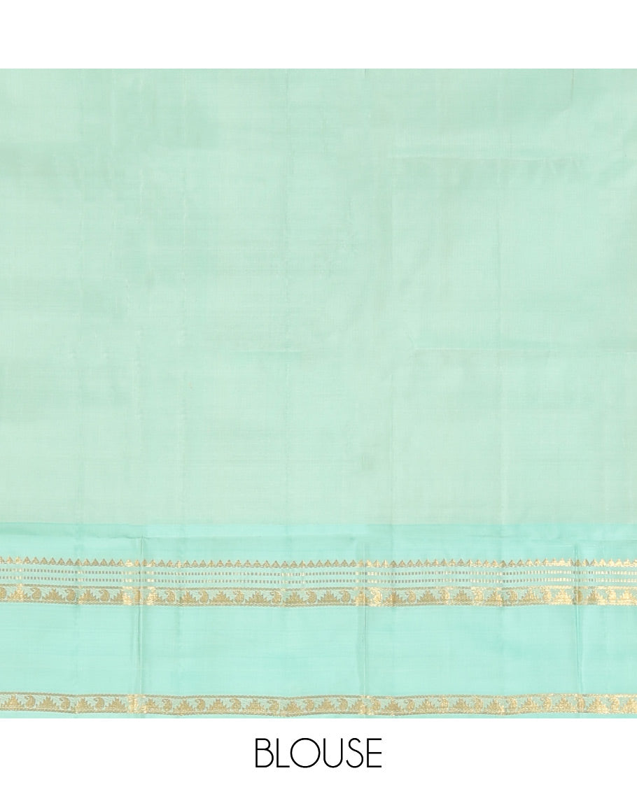 Purple Vasundhara Silk Saree, Spotlighted With Zari Buttas All Across Its Body, Complemented by Captivating Contrast Rettai Pettu Border of Thazampoo Rekku, Muthu, And Manga Designs, a Gleaming Zari Design Pallu, And Paired With a Contrast Blouse