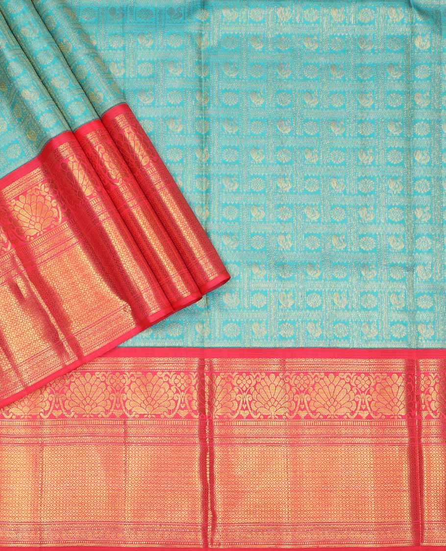 Blue pure silk half saree, mayil chakram enclosed checked skirt, contrast border and blouse of kodi visiry, neli, muthu, lavangam, and jaal, and intricate dhavani