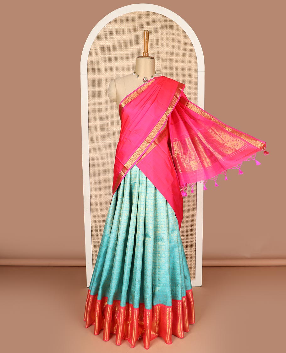 Blue pure silk half saree, mayil chakram enclosed checked skirt, contrast border and blouse of kodi visiry, neli, muthu, lavangam, and jaal, and intricate dhavani