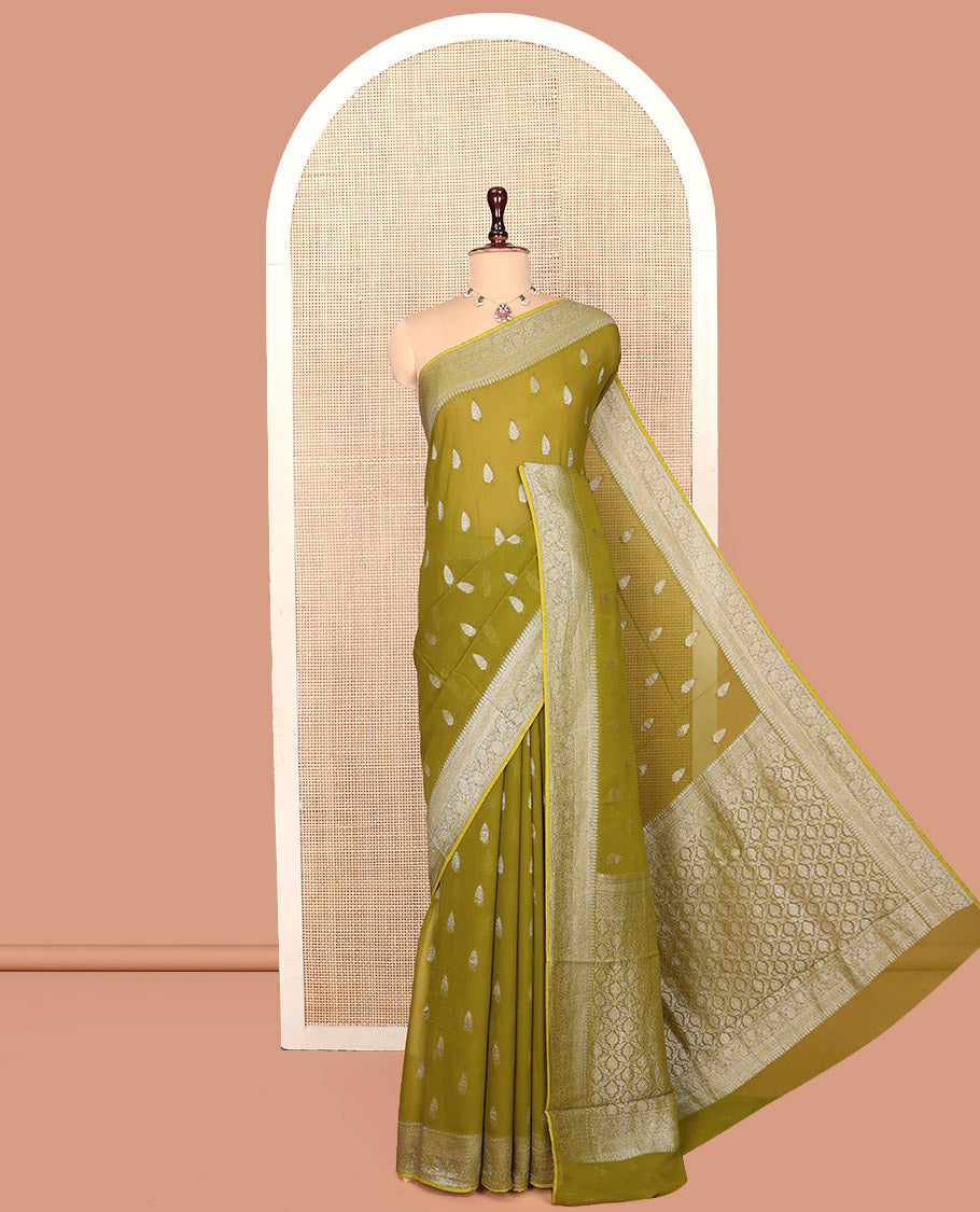 Green Georgette Saree, Steeped with Buttas, Highlighted by a Traditional Floral Creeper Border, Intricately Designed Pallu, and a Matching Blouse