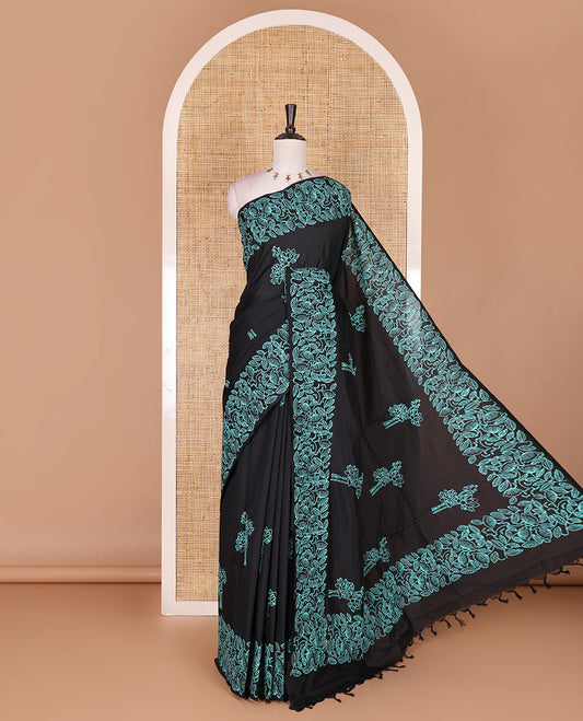 Black floral motifs hand block printed South cotton saree, floral hand block printed border and pallu, along with a contrast printed blouse