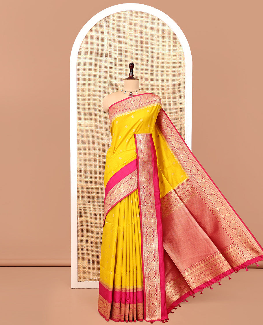 Mustard Yellow Dupion Silk Saree, Embellished with Buttas All Over Its Body, Complemented by Contrast Traditional Border of Paisleys and Chakram Designs, Intricately Designed Pallu, and Paired with a Contrast Blouse