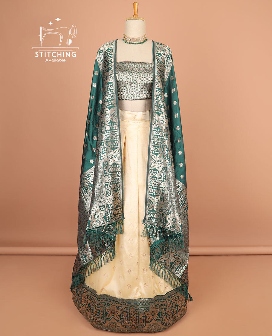 Cream buttas half saree with contrast zari design border, zari design blouse & green floral vine zari design dhavani