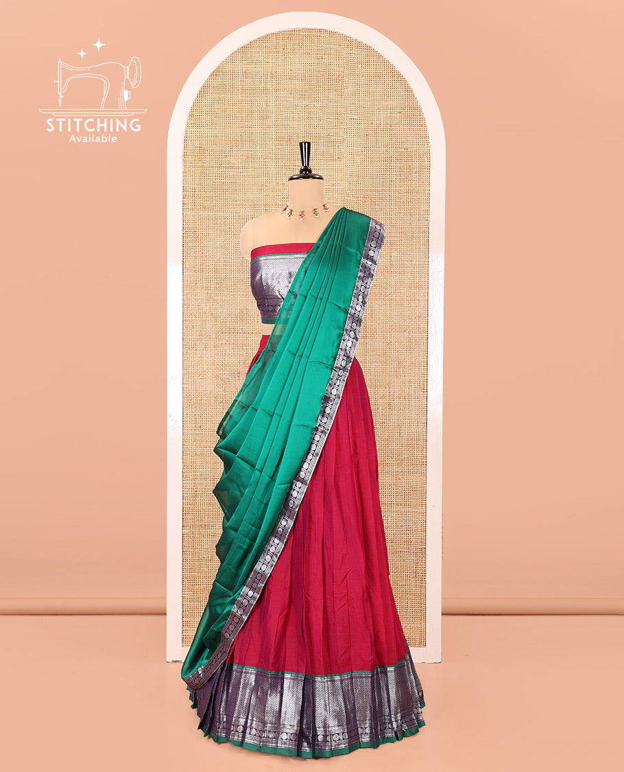 Rani Pink-Green Mercerised Cotton Half-Saree Features Plain with Contrast Traditional Zari Bordered Skirt, Paired with a Matching Blouse, and Comes with a Contrast Bordered Dhavani