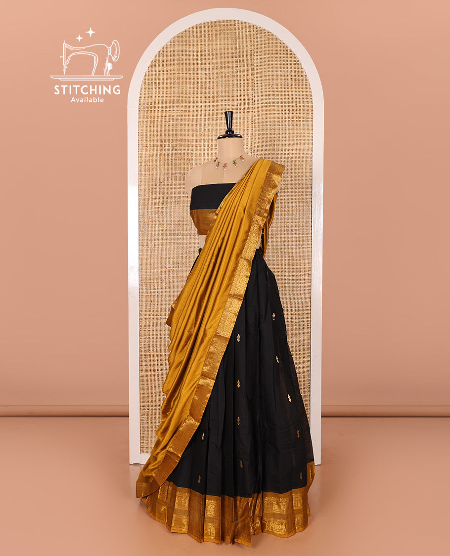 Black and Mustard Chettinad Cotton Half-Saree Featuring Buttas Woven Skirt, Highlighted with a Contrast Rettai Pettu Peacock Motifs Woven Zari Border, a Subtly Woven Matching Blouse, and a Vichitra Silk Contrast Traditional Zari-Bordered Dhavani